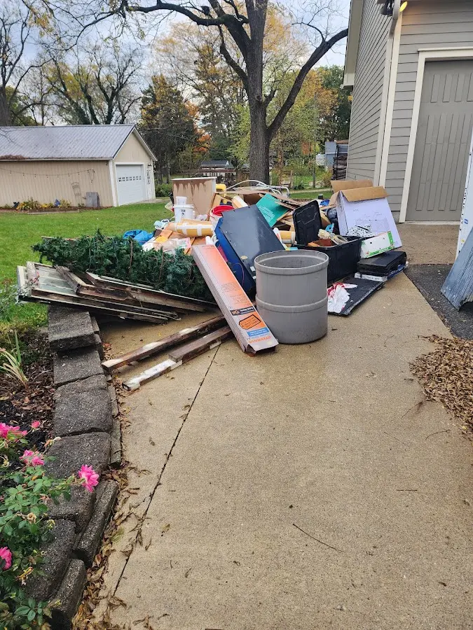 Dumpster being loaded with debris for 30 Yard Dumpster Rental in Corcoran
